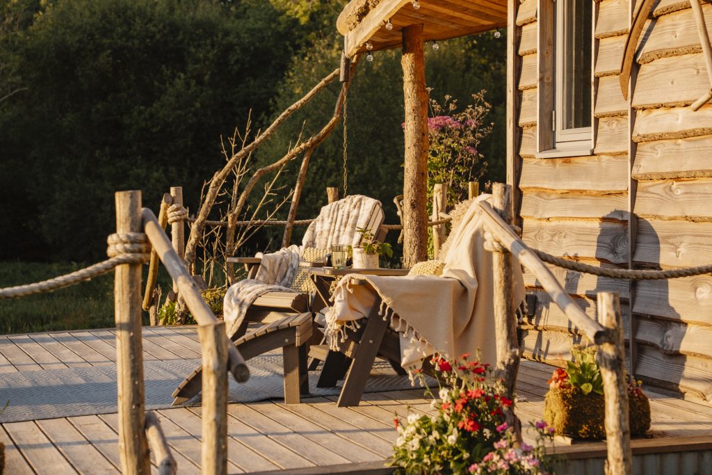 Enjoy golden hour on the decking - Glamping Cabin Carmarthenshire with Hot Tub