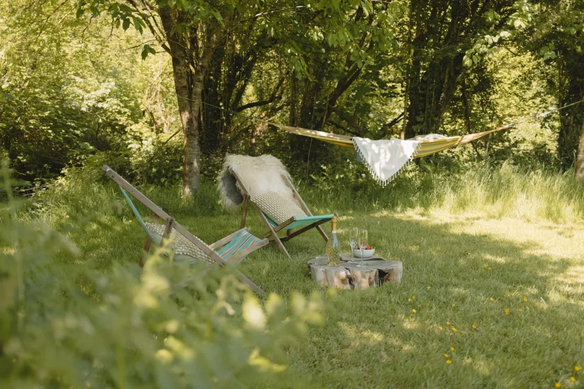 Relaxing by the river in the hammock and deckchairs - Luxury Glamping Cabin Carmarthenshire, West Wales