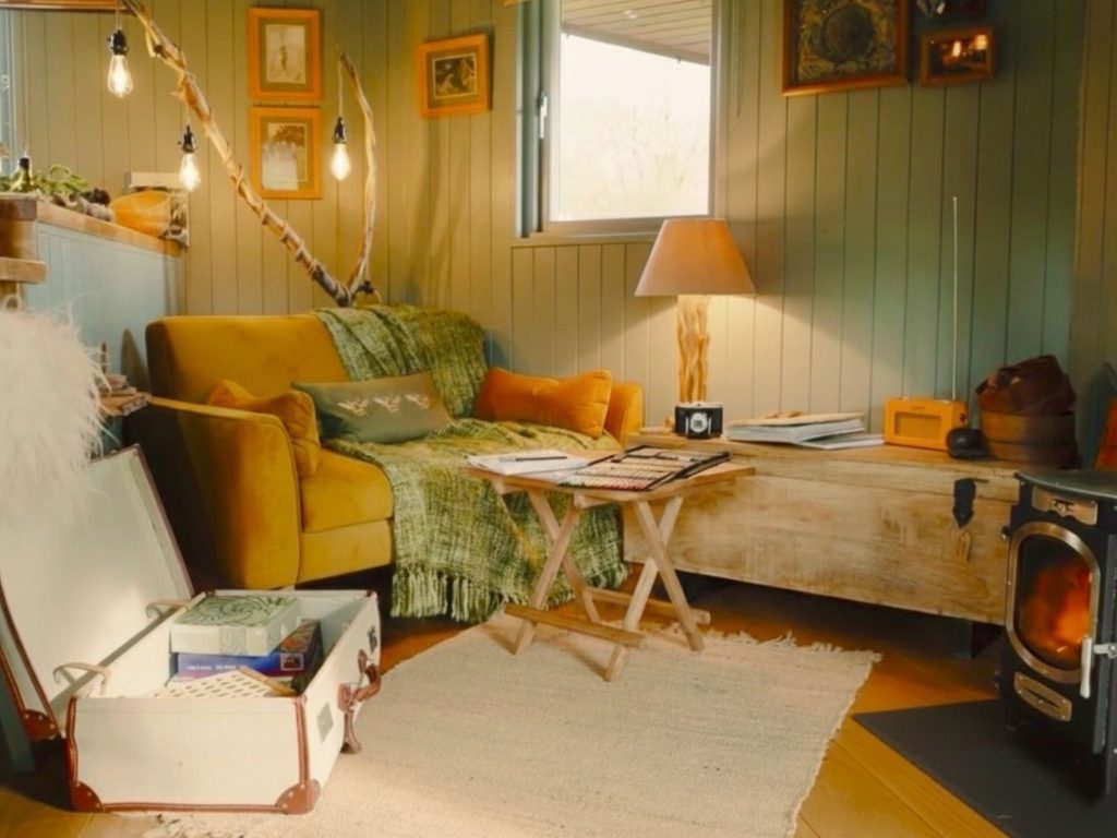 Relaxed-afternoon-by-the-fire-in-the-Cabin-Luxury-Glamping-Carmarthenshire-West-Wales